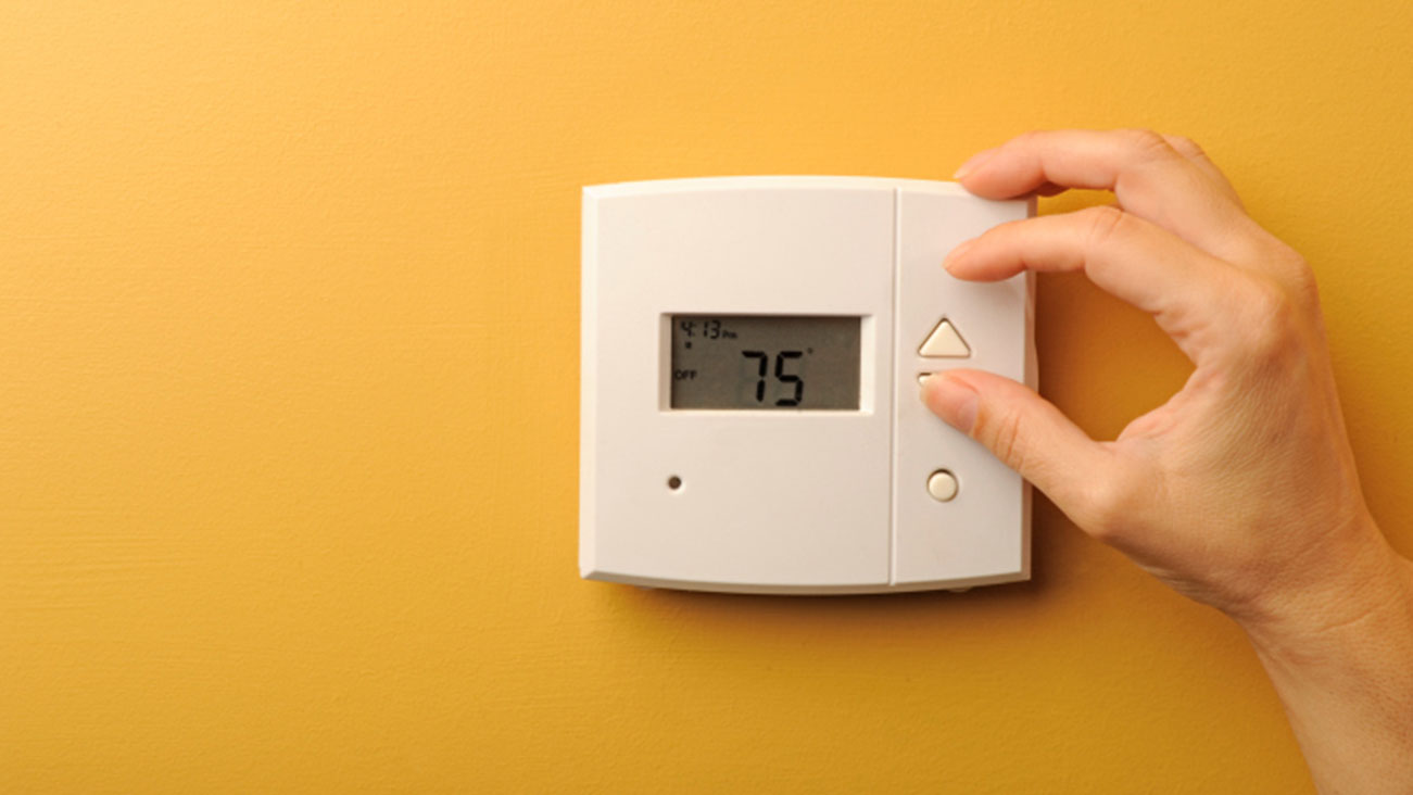 Thermostat set at 75 degrees Fahrenheit